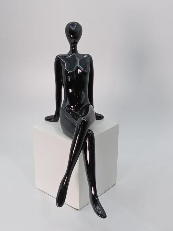 Lady sitting stature